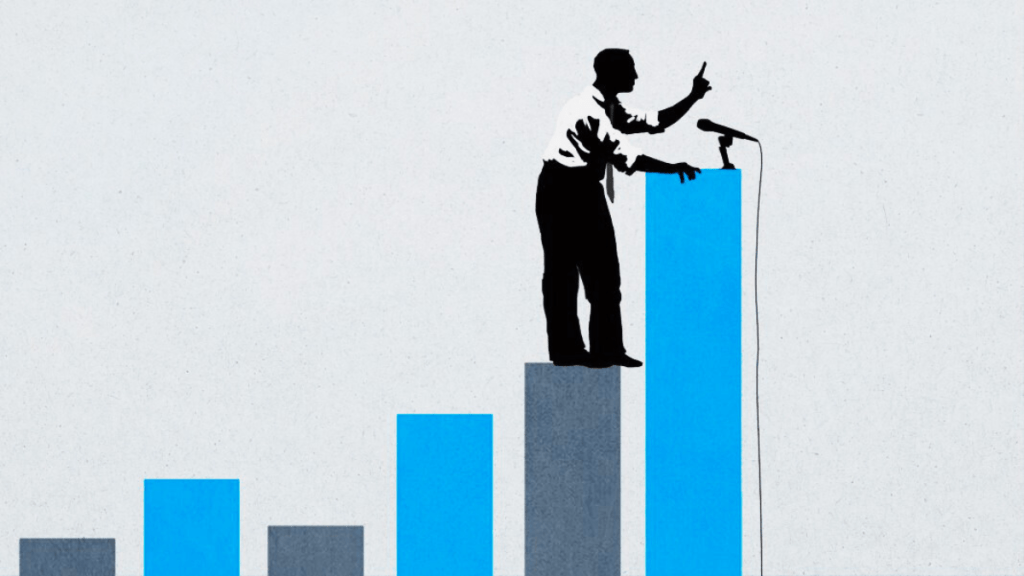 A silhouette of a man in a suit standing on a blue bar graph, gesturing while holding a microphone.