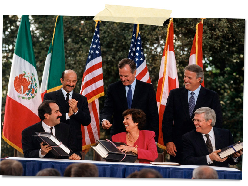 Ceremonia de firma de un acuerdo con varios líderes, junto a banderas de México, Estados Unidos y Canadá, en un ambiente festivo.